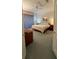Spacious bedroom featuring soft, light colors, plush carpet, and a ceiling fan for a cool, comfortable space at 8616 15Th Nw Ave, Bradenton, FL 34209