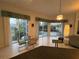 Bright dining area features a glass table, tiled floors and large windows with views of the pool and lanai at 8616 15Th Nw Ave, Bradenton, FL 34209