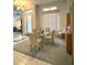 Cozy dining area with a glass table and carpet flooring at 8616 15Th Nw Ave, Bradenton, FL 34209