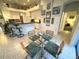 Dining room featuring modern furnishings and a view into the kitchen with breakfast bar at 8616 15Th Nw Ave, Bradenton, FL 34209