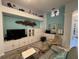 Living room features a decorative sea theme, built in cabinets, tile floors and modern furnishings at 8616 15Th Nw Ave, Bradenton, FL 34209