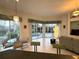 Spacious living room featuring decorative lighting and access to the enclosed patio with a hot tub at 8616 15Th Nw Ave, Bradenton, FL 34209