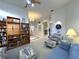 Open living room layout with built-in bookshelves and comfortable seating at 8616 15Th Nw Ave, Bradenton, FL 34209