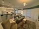 Bright living room featuring tile flooring, a ceiling fan, and large windows for lots of natural light at 8616 15Th Nw Ave, Bradenton, FL 34209