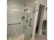 Walk-in shower includes built in grab bars and a multi-setting shower head at 8616 15Th Nw Ave, Bradenton, FL 34209