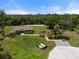 Breathtaking aerial view showcasing a community's pavilion and boat launch area near a serene river at 918 Fernleaf Run, Bradenton, FL 34212