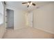 Bedroom with carpeted floors, natural light, and access to a closet and en-suite bathroom at 918 Fernleaf Run, Bradenton, FL 34212