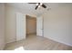 Spacious bedroom features wood floors, a ceiling fan, and an attached closet at 918 Fernleaf Run, Bradenton, FL 34212