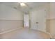Bright bedroom with neutral walls, double door closet, plush carpet, and a ceiling fan at 918 Fernleaf Run, Bradenton, FL 34212