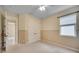 Bedroom with plush carpeting, double door closet, and view of the hallway at 918 Fernleaf Run, Bradenton, FL 34212