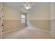 Neutral bedroom with wainscoting, plush carpet, and a ceiling fan, offering a calming space at 918 Fernleaf Run, Bradenton, FL 34212