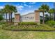 A beautifully landscaped entrance sign for Riverside Preserve, framed by palm trees and colorful flowers at 918 Fernleaf Run, Bradenton, FL 34212