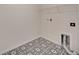 Laundry room features patterned tile floor, shelf and washing machine hook ups at 918 Fernleaf Run, Bradenton, FL 34212