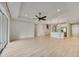 Spacious living area with ample natural light and an open floor plan leading to the kitchen at 918 Fernleaf Run, Bradenton, FL 34212