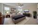 Comfortable primary bedroom featuring natural light, a ceiling fan, and stylish decor at 918 Fernleaf Run, Bradenton, FL 34212