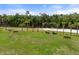 Scenic riverfront view featuring a sandy beach, benches, and lush greenery, ideal for relaxation and outdoor enjoyment at 918 Fernleaf Run, Bradenton, FL 34212