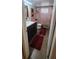 Bathroom featuring dark wood vanity, sink and red accents at 120 Sw Monroe N Cir, St Petersburg, FL 33703