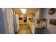 Efficient kitchen featuring tiled floors, ample countertop space, and generous cabinetry, perfect for cooking at 120 Sw Monroe N Cir, St Petersburg, FL 33703