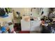 Functional laundry area with sink, washer, and dryer, offering convenience for household chores at 120 Sw Monroe N Cir, St Petersburg, FL 33703