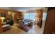 Comfortable living room showcasing hardwood floors, a bright window, and stylish seating arrangement at 120 Sw Monroe N Cir, St Petersburg, FL 33703