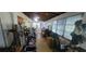 This patio features a treadmill, chairs and natural light at 120 Sw Monroe N Cir, St Petersburg, FL 33703