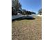 Large, fully-fenced backyard with grass and a trampoline at 1224 38Th W St, Bradenton, FL 34205