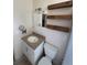 Modest bathroom featuring decorative shelves, vanity, toilet and shower at 1224 38Th W St, Bradenton, FL 34205