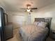 Bedroom with closet, dresser, ceiling fan, and comfortable bed at 1224 38Th W St, Bradenton, FL 34205