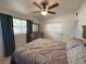 Bedroom with closet, dresser, ceiling fan, and comfortable bed at 1224 38Th W St, Bradenton, FL 34205