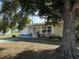 Inviting single-story home featuring a mature shade tree and a playful tire swing in the front yard at 1224 38Th W St, Bradenton, FL 34205