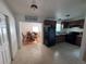 Well-equipped kitchen featuring durable flooring, a full appliance suite, and a view into the dining area at 1224 38Th W St, Bradenton, FL 34205