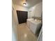 Convenient laundry room with a modern washer and dryer set and ample cabinet storage at 1224 38Th W St, Bradenton, FL 34205