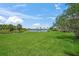 Green lawn and lake, a serene outdoor view at 13391 Dimarco St, Venice, FL 34293