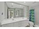 Bright bathroom with a double vanity, shower and toilet at 13391 Dimarco St, Venice, FL 34293