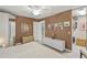Bedroom boasts a king bed, art on the walls and a walk-in closet at 13391 Dimarco St, Venice, FL 34293