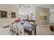 Open dining area offers seating for six and transition to the cozy living and kitchen areas at 13391 Dimarco St, Venice, FL 34293