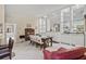 Elegant dining room with a stylish table and chairs, complemented by built-in display shelves at 13391 Dimarco St, Venice, FL 34293