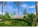 A decorative IslandWalk at the West Villages sign framed by lush greenery and swaying palm trees creates a welcoming entrance at 13391 Dimarco St, Venice, FL 34293