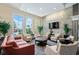 Resident lounge with large windows, stylish seating, and stone accent wall at 13391 Dimarco St, Venice, FL 34293