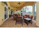 Covered patio area with comfortable seating and views of the pool at 13391 Dimarco St, Venice, FL 34293