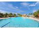 Beautiful aqua-blue pool with clear water and comfortable lounge seating at 13391 Dimarco St, Venice, FL 34293