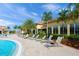 Upscale poolside lounge area with comfortable seating and tropical landscaping at 13391 Dimarco St, Venice, FL 34293