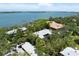 A beautiful waterfront house is featured in this aerial view of the property and surrounding area at 1347 Landings Dr # 6, Sarasota, FL 34231