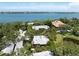 A beautiful waterfront house is featured in this aerial view of the property and surrounding area at 1347 Landings Dr # 6, Sarasota, FL 34231