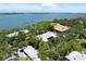 A beautiful waterfront house is featured in this aerial view of the property and surrounding area at 1347 Landings Dr # 6, Sarasota, FL 34231