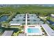 A picturesque community featuring tennis courts, a pool, and a pond surrounded by lush greenery at 1347 Landings Dr # 6, Sarasota, FL 34231