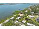Aerial view of waterfront homes surrounded by lush greenery, showcasing the community's serene setting and water access at 1347 Landings Dr # 6, Sarasota, FL 34231