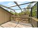 Enclosed balcony with wooded view and outdoor ceiling at 1347 Landings Dr # 6, Sarasota, FL 34231