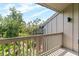 Outdoor balcony view with green trees and a blue sky at 1347 Landings Dr # 6, Sarasota, FL 34231