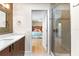 Bathroom with walk-in shower and vanity. Also an open door into the bedroom at 1347 Landings Dr # 6, Sarasota, FL 34231